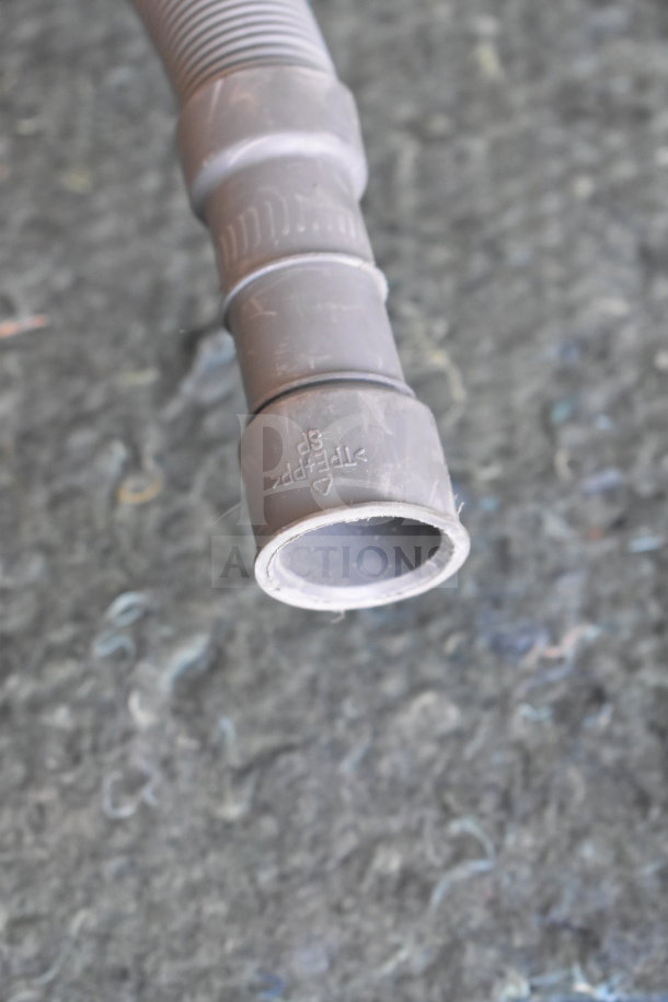 Close-up of a hose related to the Honeywell HDS18SS Dishwasher. Features plastic construction showing the "PFFP" marking.
