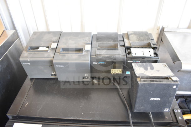 Five used receipt printers, including Epson and Star TSP100III models, showing signs of wear.