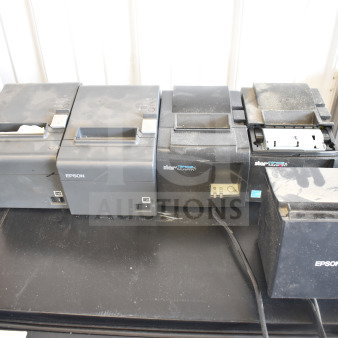 Five used receipt printers, including Epson and Star TSP100III models, showing signs of wear.