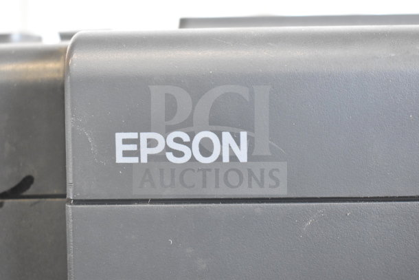 Five receipt printers including Epson and Star TSP100III, used condition, ideal for business use, with visible Epson branding.
