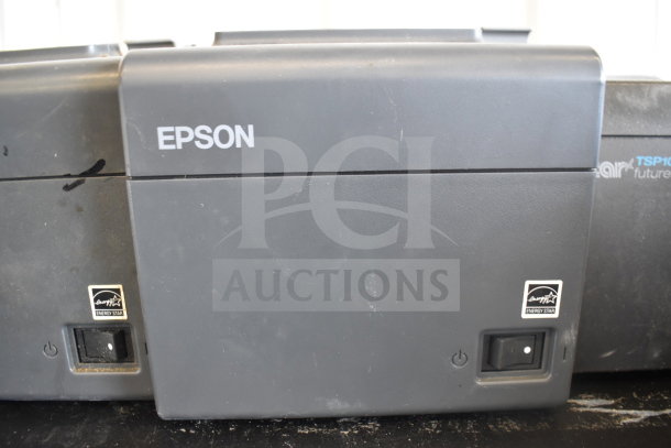Five receipt printers including Epson and Star TSP100III models. Signs of wear, Energy Star label visible.