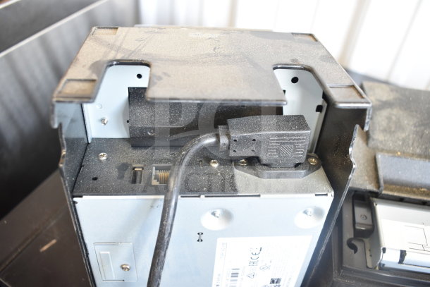 Five receipt printers, including Epson and Star TSP100III models. Visible ports and power cable. Used condition with dust.