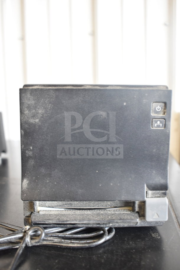 Set of 5 receipt printers including Epson and Star TSP100III; visible wear. Features power and paper feed buttons.