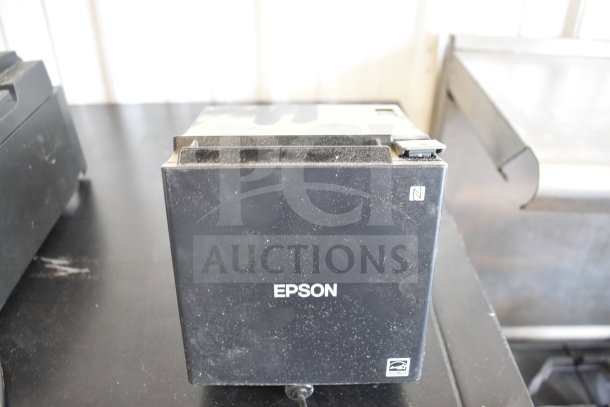 Five receipt printers including Epson and Star TSP100III, used condition, visible wear, ideal for retail environments.