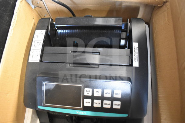 Kolibri Automatic Bill Counter in original box. Features include MG, UV, ADD, and BAT functions. Condition: new. 110V, 1 Phase.