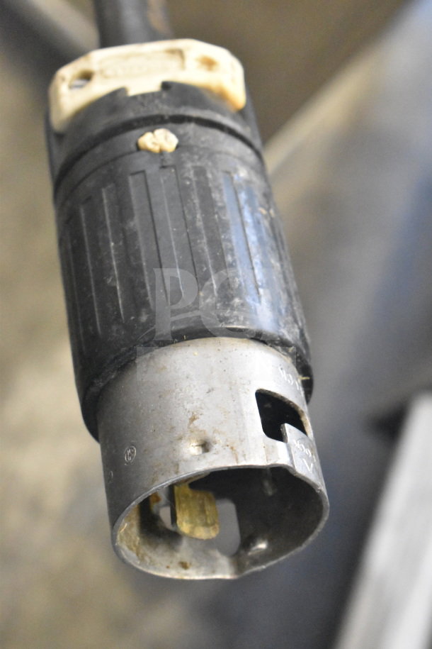 Industrial power plug for CreCor Commercial Heated Holding Cabinet, shown close-up. Sturdy, metal finish with visible wear.