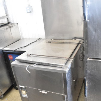 Baxter SP155G-M1826 commercial floor-style natural gas donut fryer in stainless steel, used condition, with control panel visible.