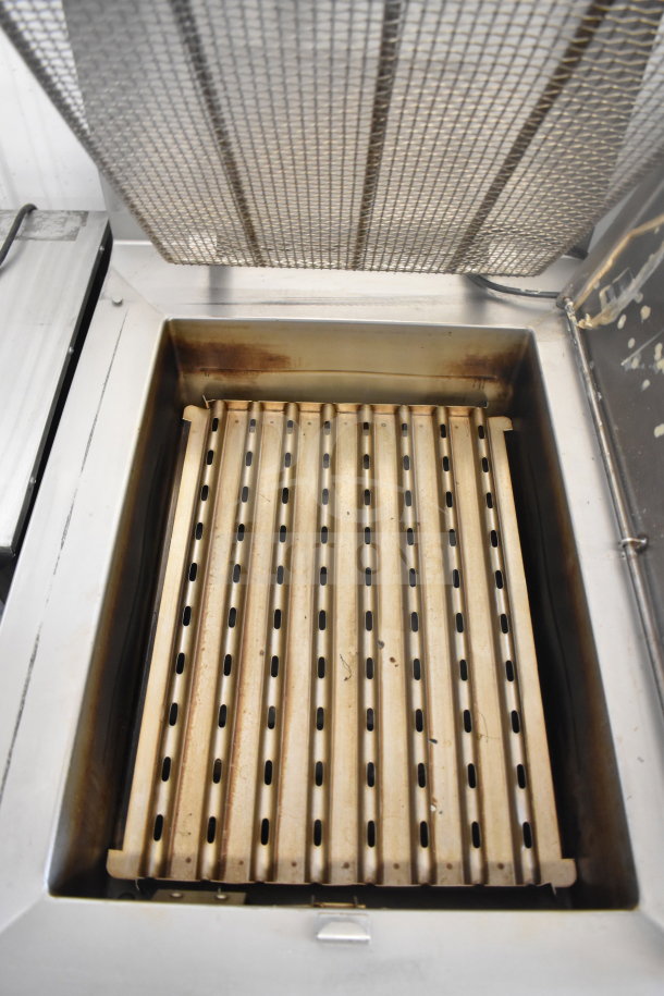 Baxter SP155G-M1826 commercial donut fryer, natural gas powered, floor style, metal insert, visible wear marks.