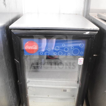 Imbera EVC04 Commercial Mini Cooler Merchandiser, 115V, 1 Phase. Features glass door, Coca-Cola branding, visible shelving.