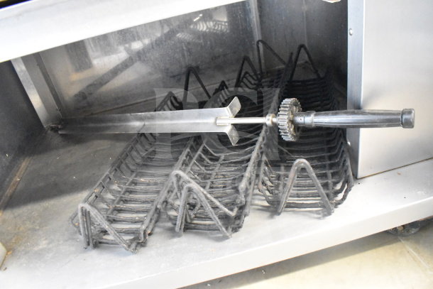 Fri-jado TDR 7-P commercial rotisserie oven on casters, with visible rotisserie racks and handle. Condition appears used.