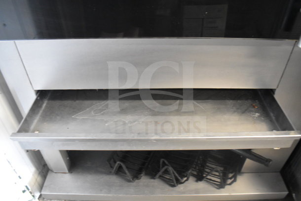 Fri-jado TDR 7-P commercial rotisserie oven on casters, stainless steel, electric, 208V, 3-phase, used condition.