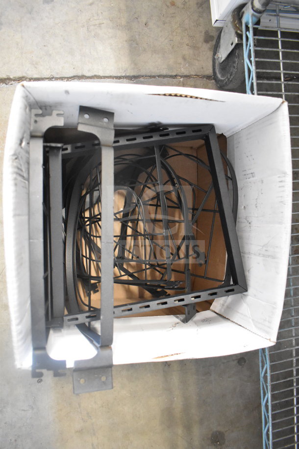 Lot of various metal racks in a box, potentially used for storage or display. Items appear in good condition.