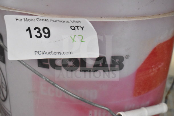 Ecolab cleaner barrels; Ultra Klene detergent and Ultra San sanitizer, Qty 2, auction tag visible, partial label shown.