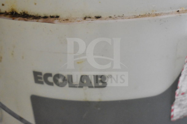 Ecolab barrel containing Ultra Klene Detergent; visible dirt and wear on outer surface; label reads "Ecolab".