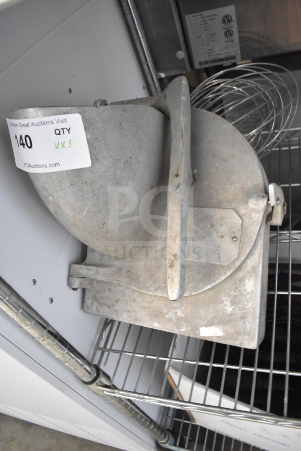 Pelican head, S blade, and whisk attachment, visibly used, with auction tag "140 QTY VX3" attached.