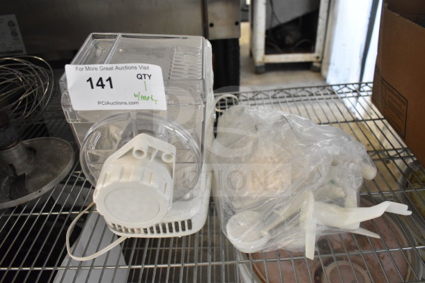 Popeil P400 Automatic Pasta Maker with parts, 120V, 1 phase. Clear plastic body, good condition. Auction tag reads "141."