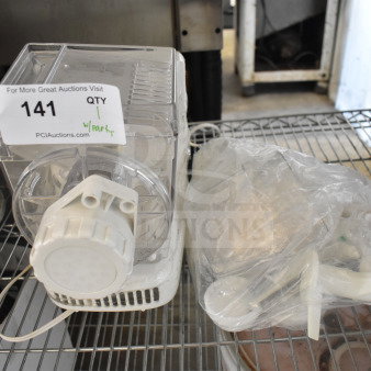 Popeil P400 Automatic Pasta Maker with parts, 120V, 1 phase. Clear plastic body, good condition. Auction tag reads "141."