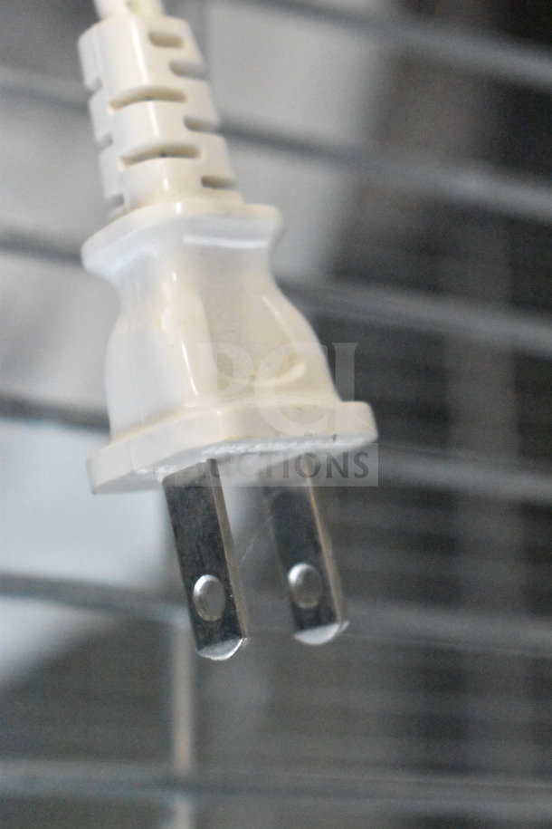 Power plug of Popeil P400 Automatic Pasta Maker, 120 Volts, 1 Phase, close-up view. Clean and well-maintained condition.