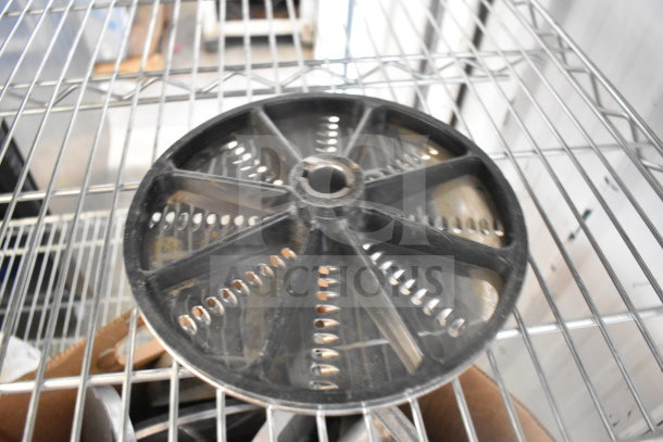 20 various kitchen items, including a large round food processor blade on a metal shelf, suitable for bid increase.