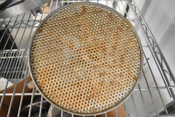 20 assorted items, including diverse food processor blades, displayed on a metal rack. Items appear used, with visible wear.