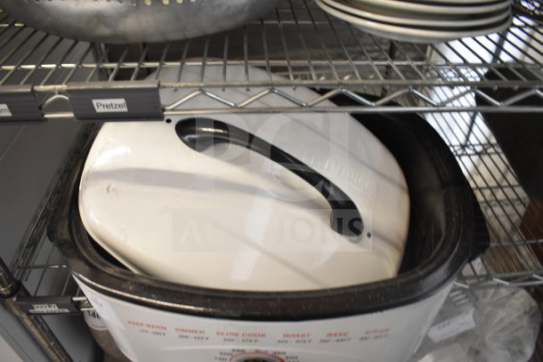 Welbilt RS10M 10 Quart Roaster Oven, white with black handle, 120 Volts, 1 Phase, visible cooking guide on side.