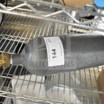 Carbon Dioxide Tank, moderate wear, brass valve, blue handle, label with auction info. Buyer must pick up.