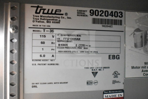 Label of 2017 True T-35 Commercial 2 Door Reach In Cooler showing model, voltage, refrigerant type, and serial number.