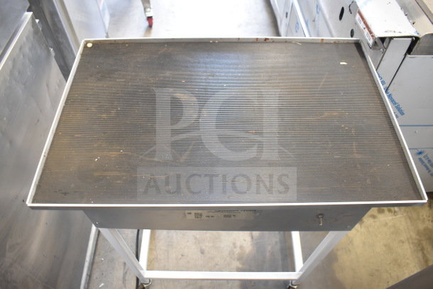 Hilliard's Floor Style Chocolate System, 120V, 1 Phase. Used condition, visible surface wear on metal tabletop.