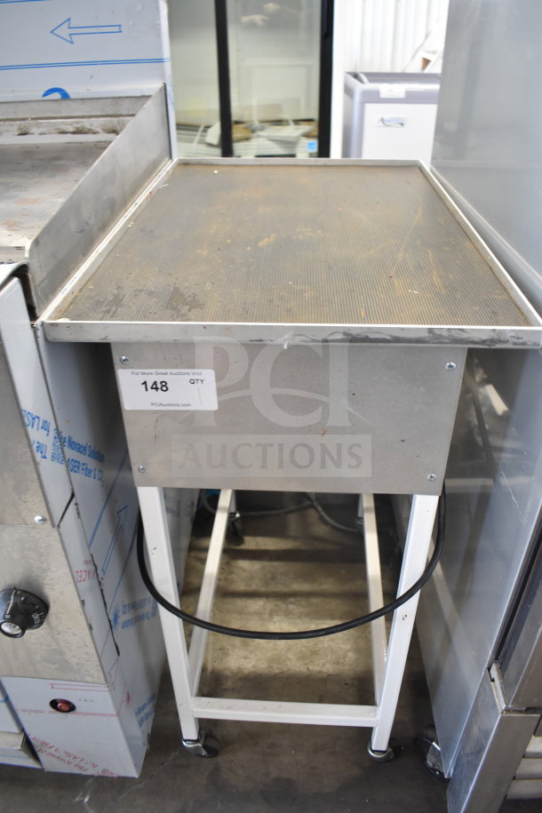 Hilliard's Floor Style Chocolate System, 120V, 1 Phase, stainless steel with a flat top and four wheels, visible wear.