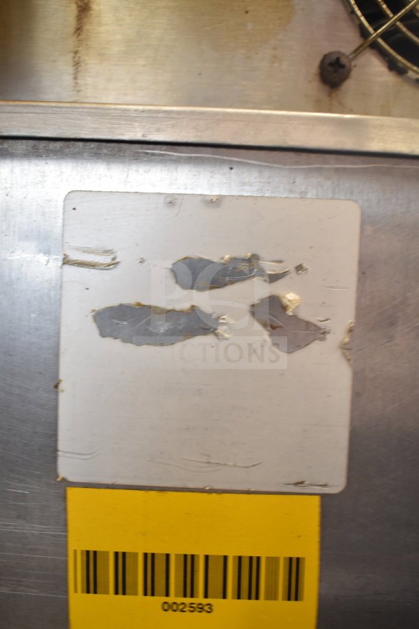 HU18-671-120 Commercial Heated Holding Cabinet with visible wear, serial number 002593 on damaged label, on commercial casters.