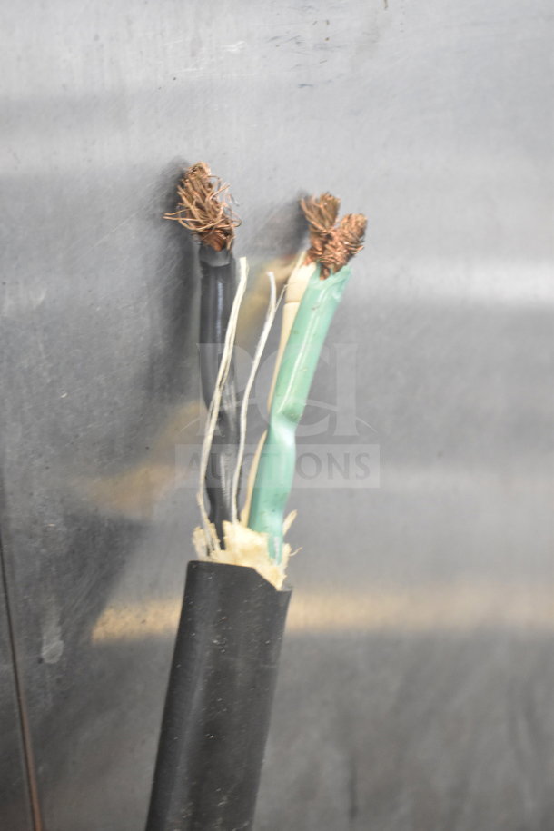 Frayed electrical wiring exposed on a metal surface, likely indicating a repair need for the HU18-671-120 heated holding cabinet.