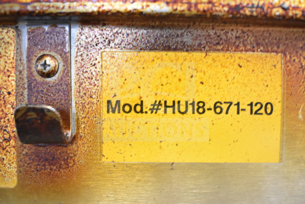 Commercial heated holding cabinet model HU18-671-120 with visible rust and wear on surface.