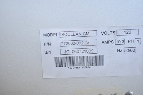 Johnson Controls Isoclean CM air filter, 120V, 1 phase, model label showing model, P/N, and S/N details.