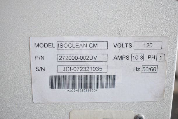 Johnson Controls Isoclean CM commercial air filter label showing 120 volts, 1 phase, model Isoclean CM, P/N 272000-002UV.