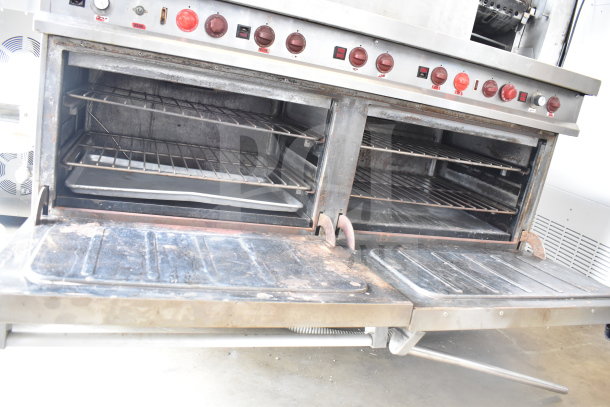 Vulcan ESB60 commercial electric range with 10 burners, 2 ovens, over shelf, and back splash. 208V, 3 phase. Slight wear.