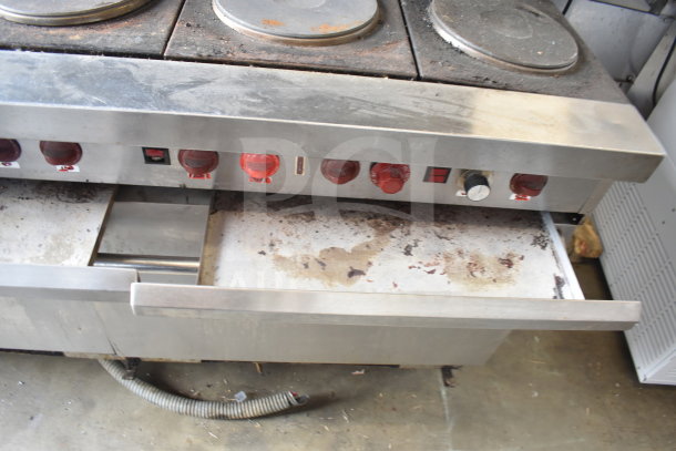 Vulcan ESB60 commercial electric 10-burner range with 2 ovens, over shelf, and backsplash. Some visible wear and residue.