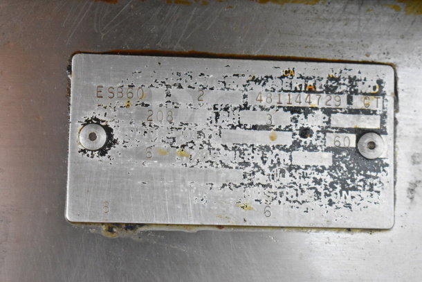 Metal nameplate for Vulcan ESB60 electric range, 208 volts, 3 phase; details worn and partially obscured.