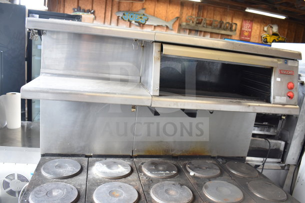 Vulcan ESB60 commercial electric range with 10 burners, 2 ovens, over shelf, and back splash. Used condition, 208V, 3 phase.