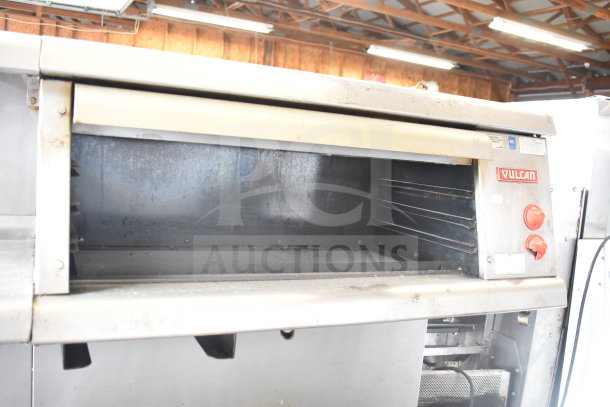 Vulcan ESB60 commercial range, featuring 10 burners, 2 ovens, over-shelf, back splash. Electric, 208V, 3-phase. Good condition.