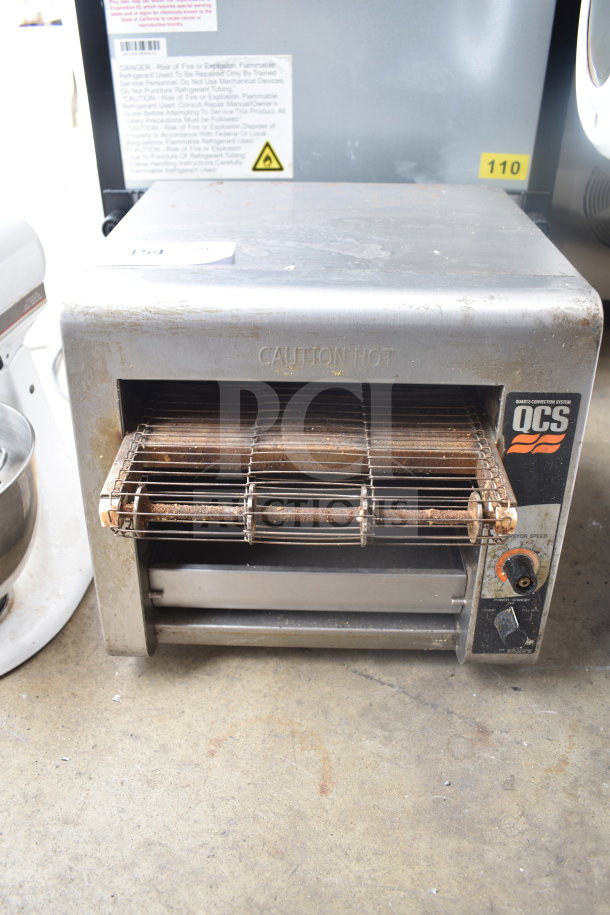 Star Holman QCS-1-350 countertop conveyor toaster oven, stainless steel, visible wear, caution hot label, 120 volts, 1 phase.