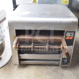 Star Holman QCS-1-350 countertop conveyor toaster oven, stainless steel, visible wear, caution hot label, 120 volts, 1 phase.
