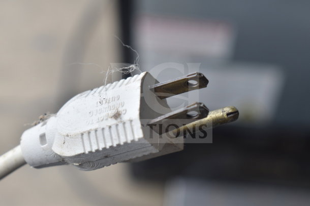 Close-up of a plug for a KitchenAid KSM90PSWH mixer. Visible wear, grounding prong present.