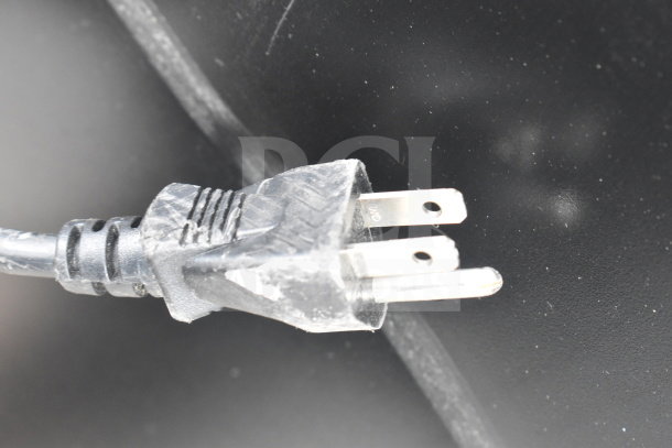 Close-up of a power plug for SG Merchandising SD-12 cooler, 110 volts, 1 phase, indicating electrical requirements.