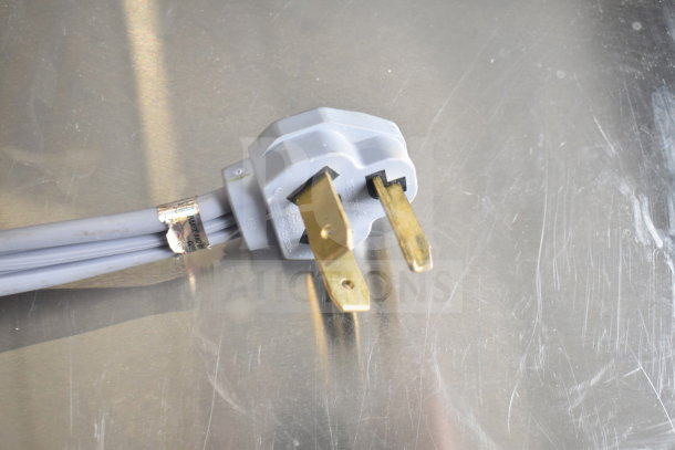 Benchfoods 60-CUD Commercial Dehydrator plug, showing a 220-240 volts power connector, gold prongs, gray cord.