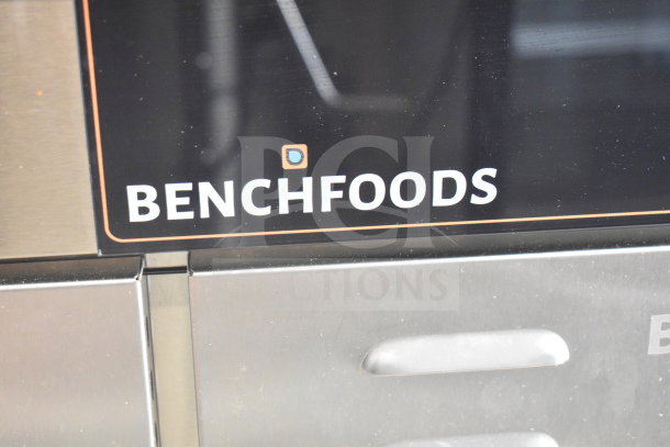Benchfoods 60-CUD Commercial Dehydrator, 60 Tray, 220-240V. Close-up of logo on stainless steel exterior, in good condition.