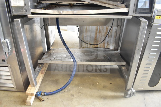 2022 Nieco FH94G Conveyor Burger Grill, propane-powered, 80,000-106,000 BTU. Visible wear, blue hose attached.
