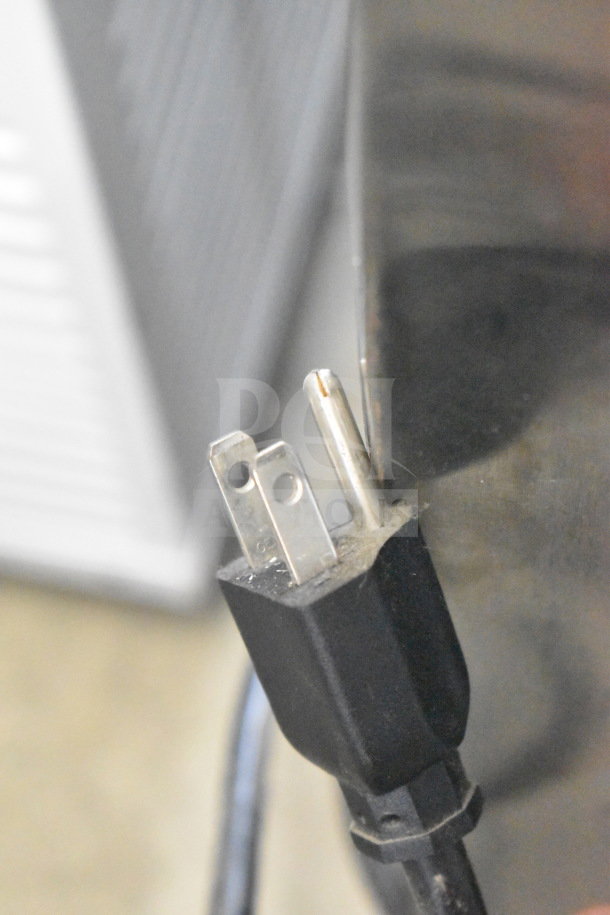 Three-prong power cord of Leader FR30 S/C cooler, 115 volts, shown against a metal surface. Plug in good condition.
