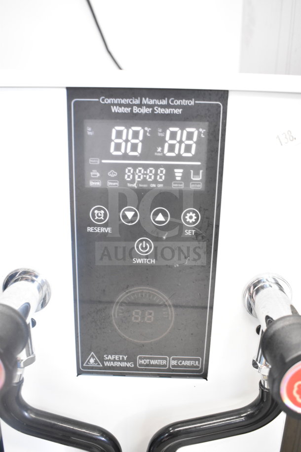 Commercial dual head steam milk frother, intelligent controls, 110V, 1 phase. Features clear digital display, reserve and set functions.
