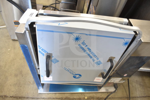 Brand new Prince Castle 297 T9 commercial bun toaster, 115V, 1 phase, with minor scratch and dent. Protective film visible.