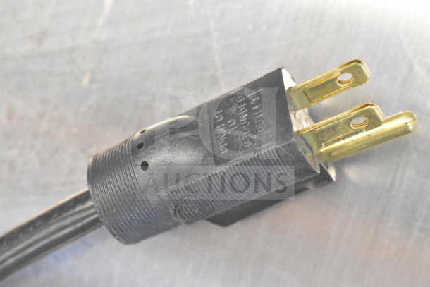 Close-up of a black three-prong plug for a Prince Castle 297 T9 commercial bun toaster, 115 volts, 1 phase.